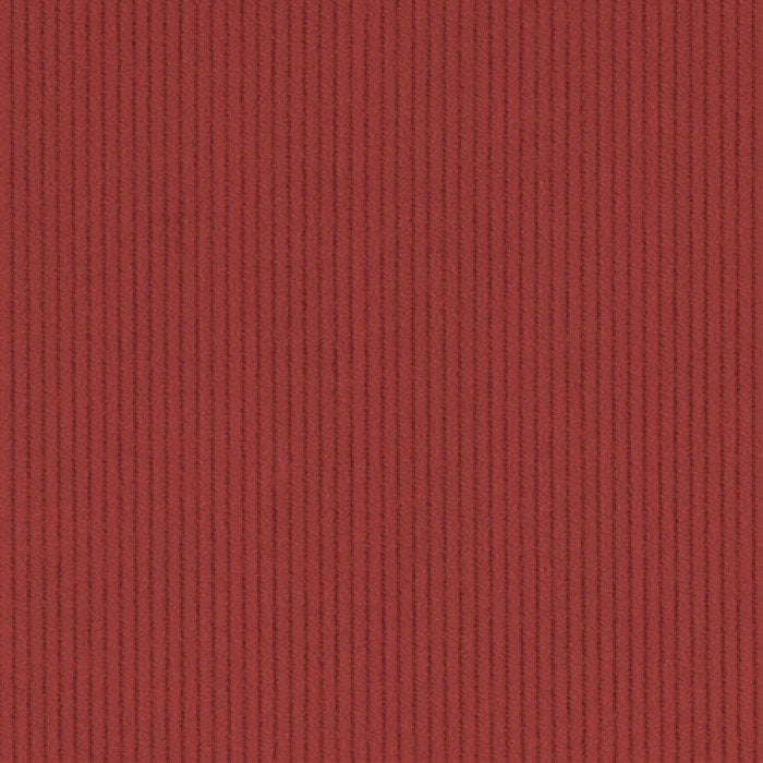 A close-up of a rust red corduroy fabric
