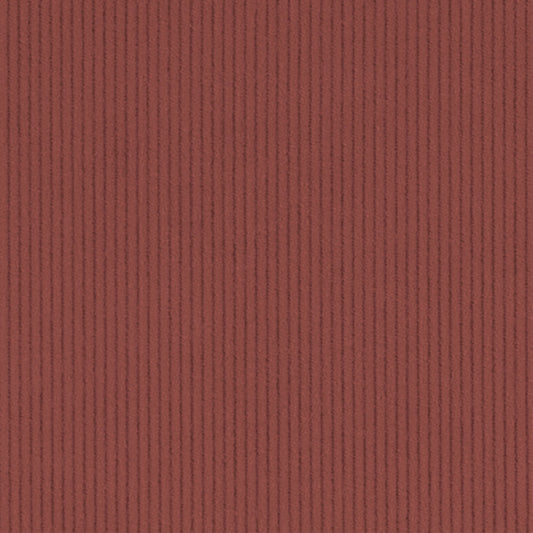 A close-up of a rust red ribbed fabric texture with vertical corduroy-like ridges.