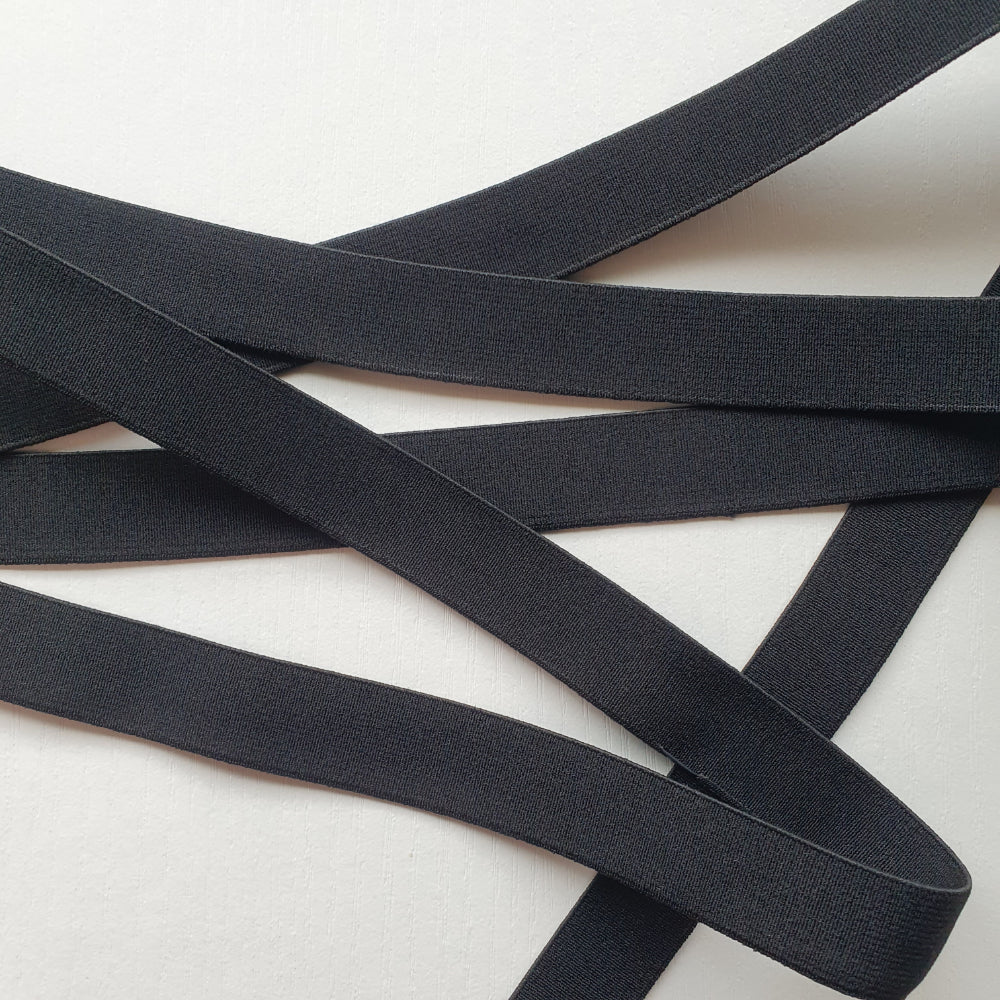 Black 20mm high density non-roll elastic arranged on a plain white background.