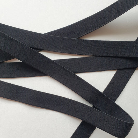 Black 20mm high density non-roll elastic arranged on a plain white background.